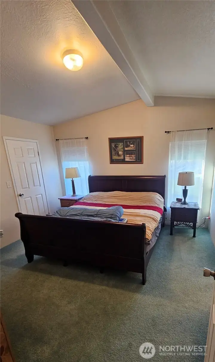 Here is the expansive primary bedroom with an en-suite bathroom and the large walk-through closet.