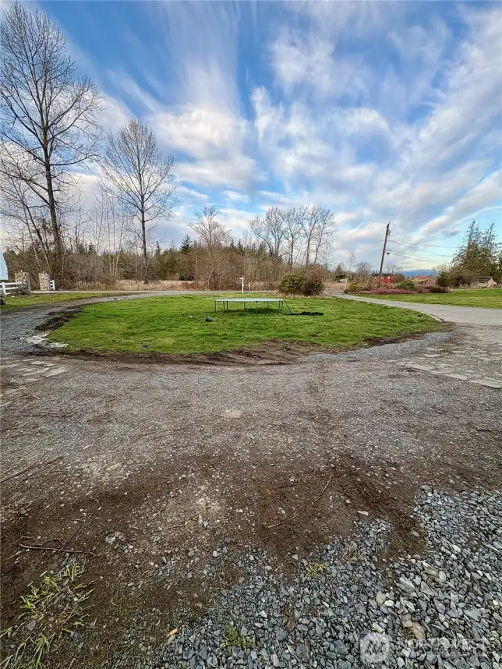Circular driveway to concrete pad