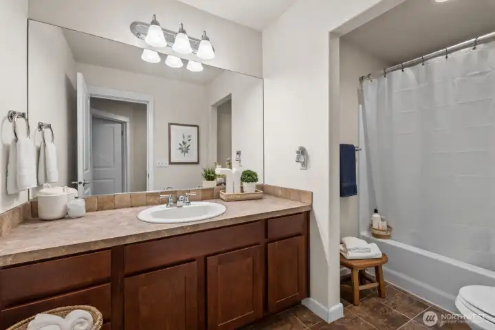 Main bath upstairs. Virtually staged.