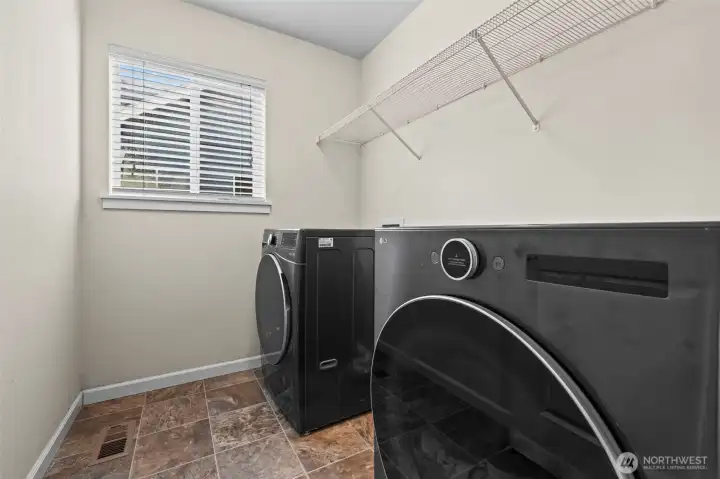 Convenient utility room on the upper level.