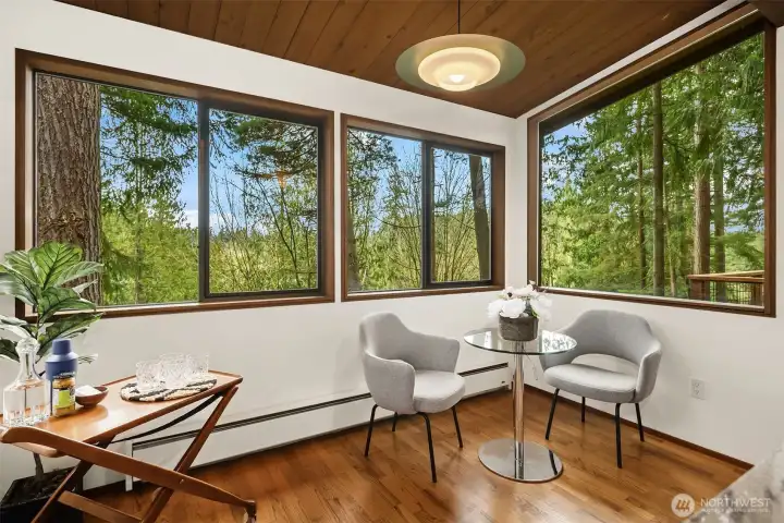 Just visible in the window on the right is the railing to the side deck, which is sizable enough for a large outdoor dining set, additional seating, and your grill of course.