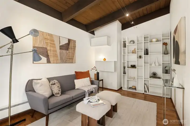 Tucked behind that kitchen wall is this delightful space with vaulted tongue-and-groove ceilings and built-in shelving.  This room flexes in many directions...TV Room...Office...Exercise Room...Arts & Crafts...