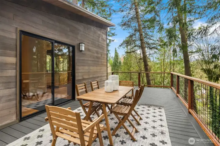 Birds singing in the trees will be the background music to your al fresco dining this summer.  Easily seat six for dinner, with additional deck space sizable enough to accommodate an outdoor sectional for lounging.