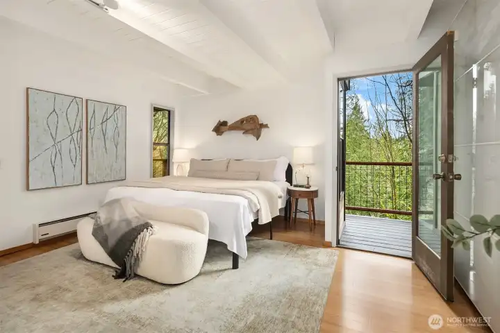 A glass door lets in light and fresh air when opened.  A covered hot tub awaits just outside...