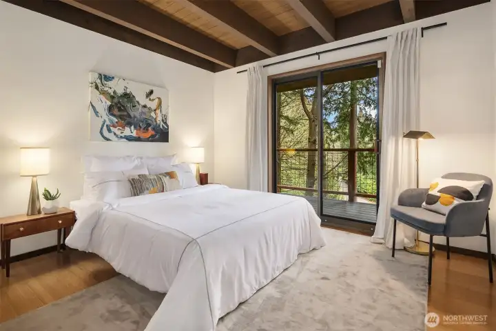 One of two bedrooms in addition to the primary suite, this one allows for a queen bed plus nightstands and a side chair.