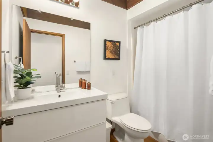 This full bath plus laundry round out the lower level.