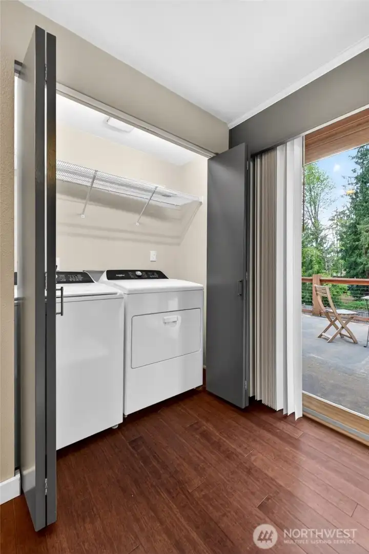 Hidden laundry closet on main floor with newer washer and dryer