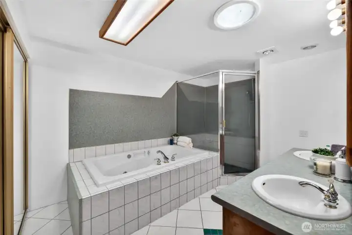 Attached primary bath is large and great opportunity to use as is or create your dream spa