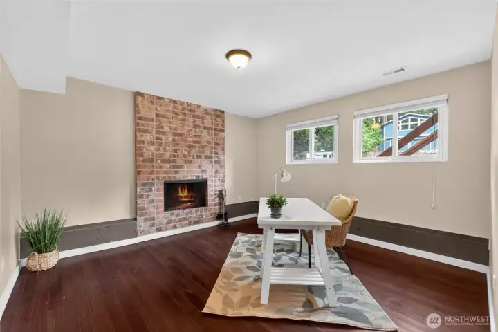 Lower level office with a closet with cozy fireplace