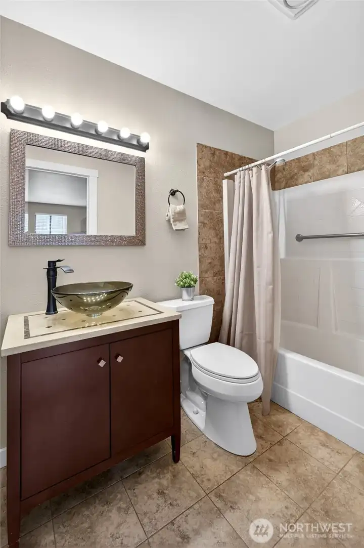 Refreshed full bath on the lower level