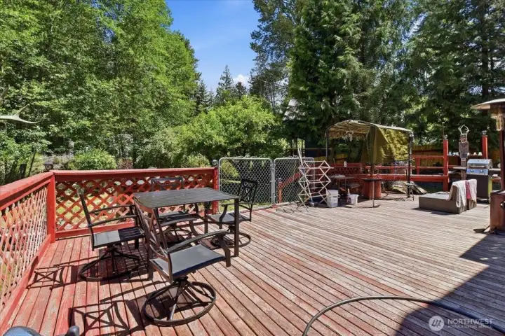 Back yard with large deck for entertaining or just taking in the sounds of Nature Back yard with large deck for entertaining or just taking in the sounds of Nature