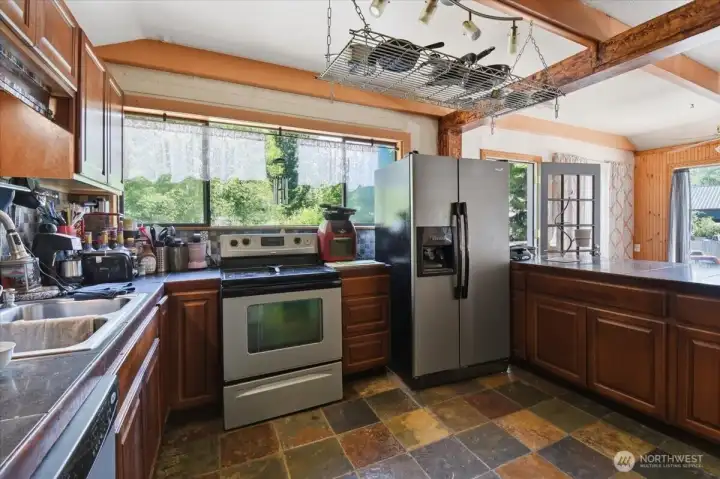Kitchen with ALL SS Appliances, Granite Tile Countertops, & Slate Flooring Kitchen with ALL SS Appliances, Granite Tile Countertops, & Slate Flooring