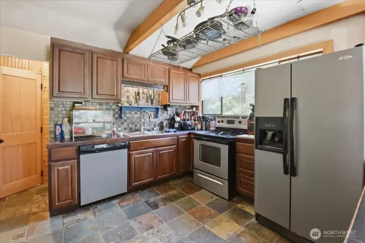 Kitchen with ALL SS Appliances, Granite Tile Countertops, & Slate Flooring Kitchen with ALL SS Appliances, Granite Tile Countertops, & Slate Flooring