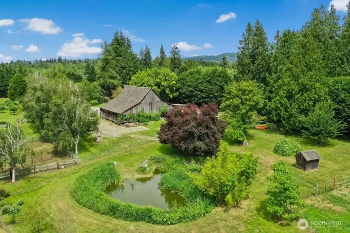covered storage areas & additional detached stalls. The acreage includes an apple (30) orchard, covered parking areas for vehicles & equipment, multiple outbuildings, beautiful pond, & room for animals. covered storage areas & additional detached stalls. The acreage includes an apple (30) orchard, covered parking areas for vehicles & equipment, multiple outbuildings, beautiful pond, & room for animals.