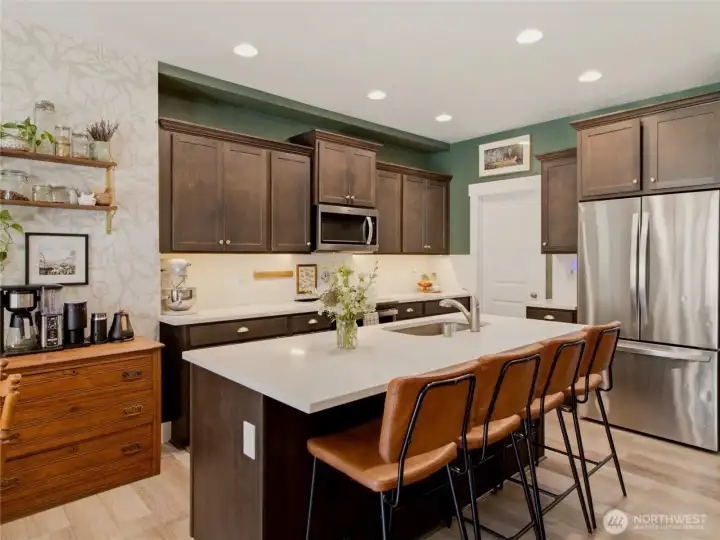 Back to kitchen with large center island, perfect for entertaining.