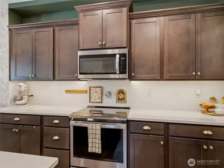 Quartz countertops and subway tile backsplash.