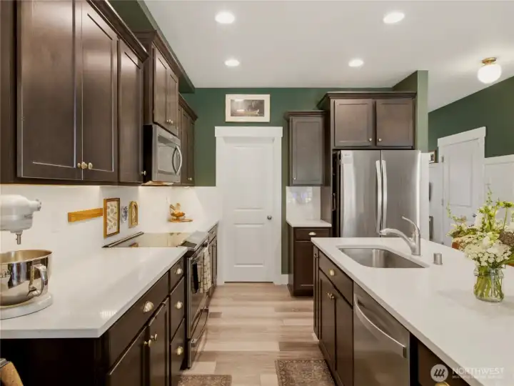 Spacious walk-in pantry with lots of shelving.