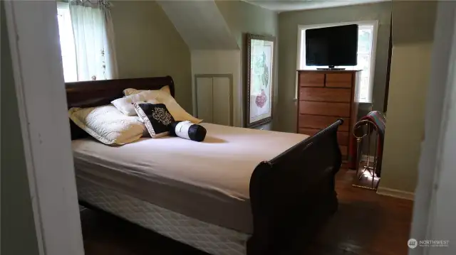 Up stair bedroom with though beautiful hardwood floors.