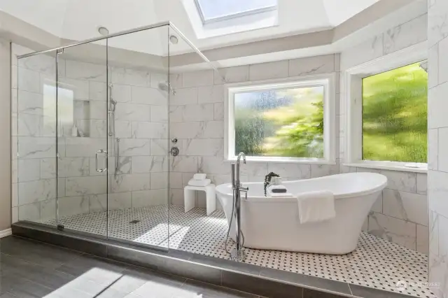 Relax with a spa day at home in this wet-room shower space and charming freestanding tub!
