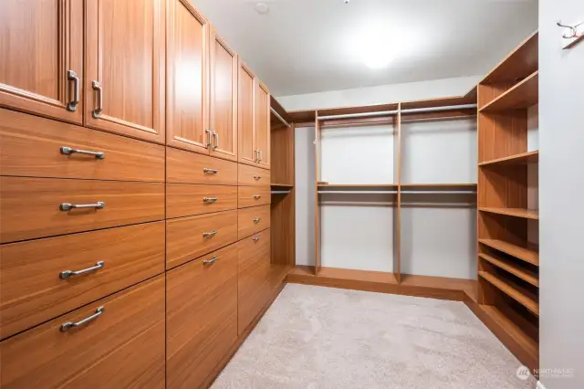 Imagine the organization with custom storage upgrades in the primary walk-in-closet!