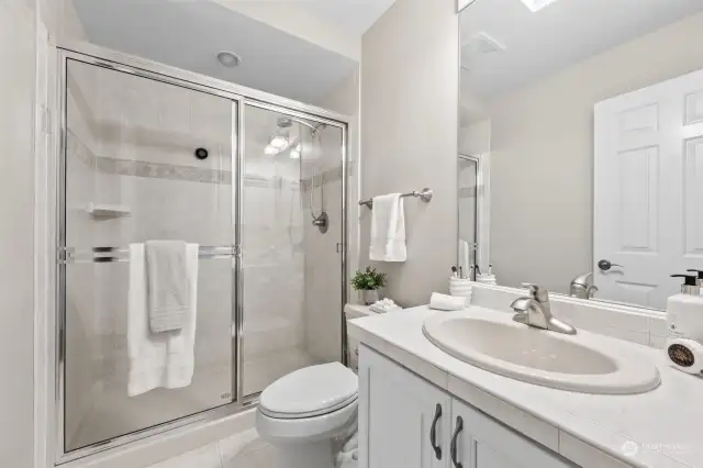 The first upstairs bedroom has an en-suite 3/4 bath with an elegantly updated shower.