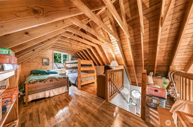Loft with continued wood flooring