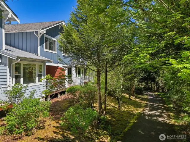 Perfectly situated with deck view of forest and pathway. Peaceful