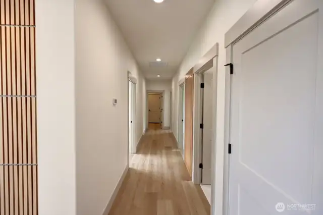 Hallway to bedrooms, utility room and garage