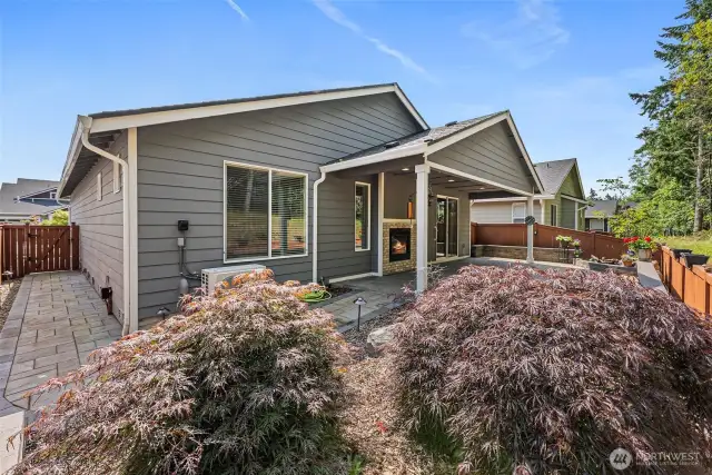 Another View of the Covered Patio, PNW Landscape, Fenced Yard, and Paved Pathway.