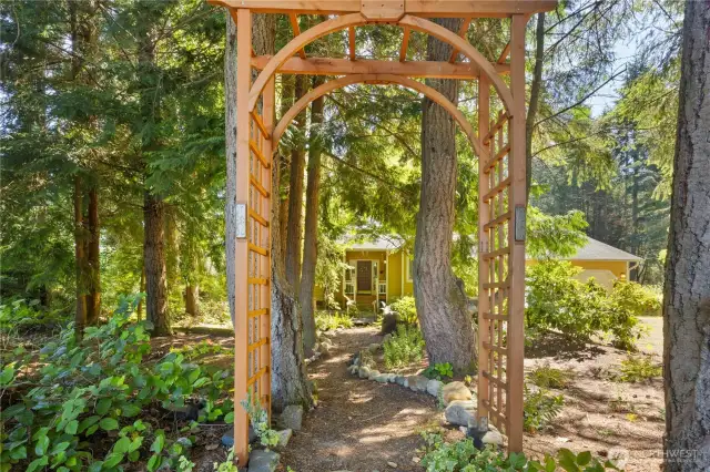 Tranquil garden path leads you to the front of the home.
