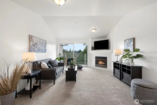 Living room with fireplace and vaulted ceilings