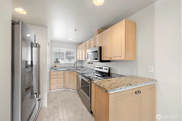 Granite Counters and newer appliances in the kitchen.