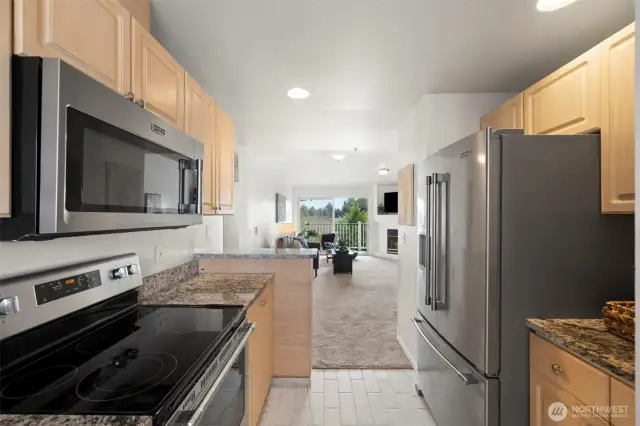 Glass cooktop and space saving microwave above.