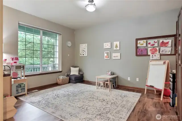On your left at entry is a large living room, currently used as a playroom for their kiddos.