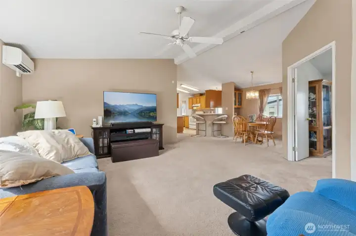 Looking from the front door - the primary suite is on the one end and the bedrooms are at the other end. Double doors on the right lead into the large den.