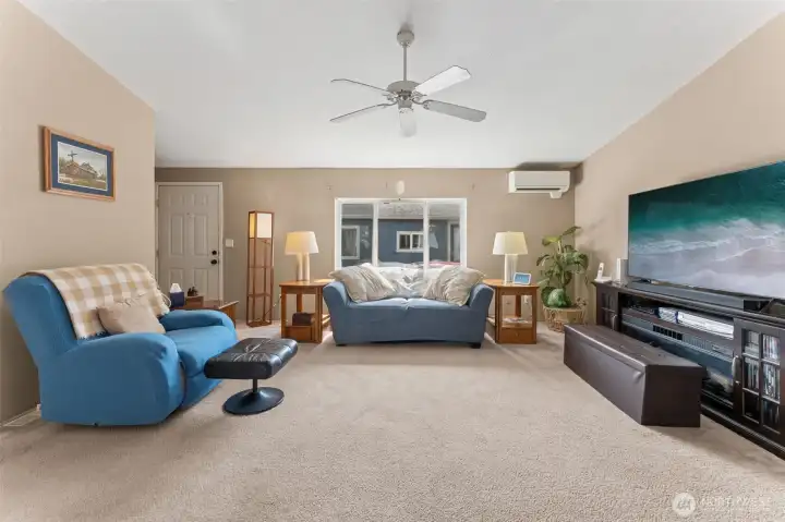Looking from the den to the large, central living room