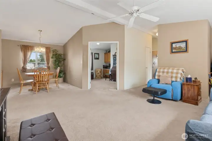 Large den straight through the double doors, bedrooms down the hall to the right.