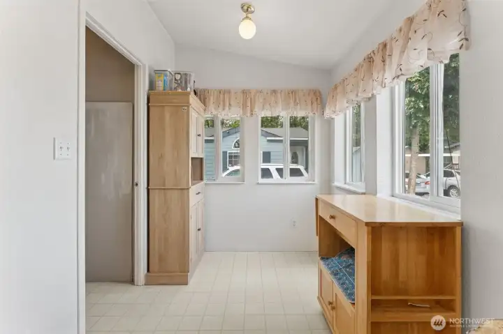 Space for a cute bistro table to enjoy morning coffee. Utility room to the left.