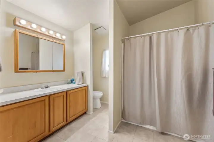 Large primary full bath with storage