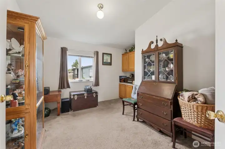 Great den with built-in cabinets - so many options! Office space, reading room, extra tv or game room