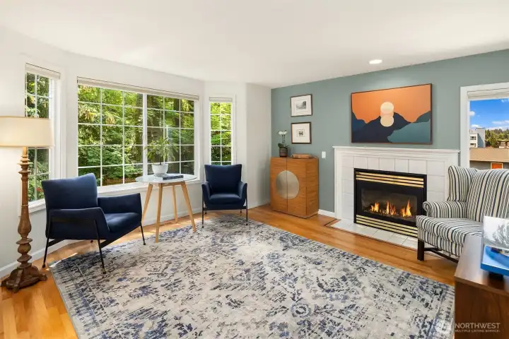 Large welcoming living room, with electric fireplace.