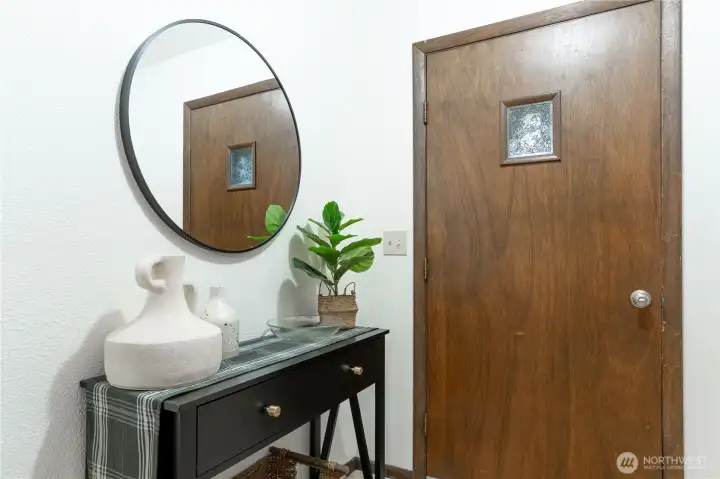 Entry is a small square area with a spacious coat closet to the left as you enter.