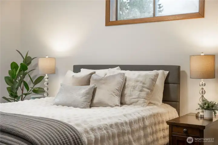 All three bedrooms are south-facing towards the backyard off of a hallway.