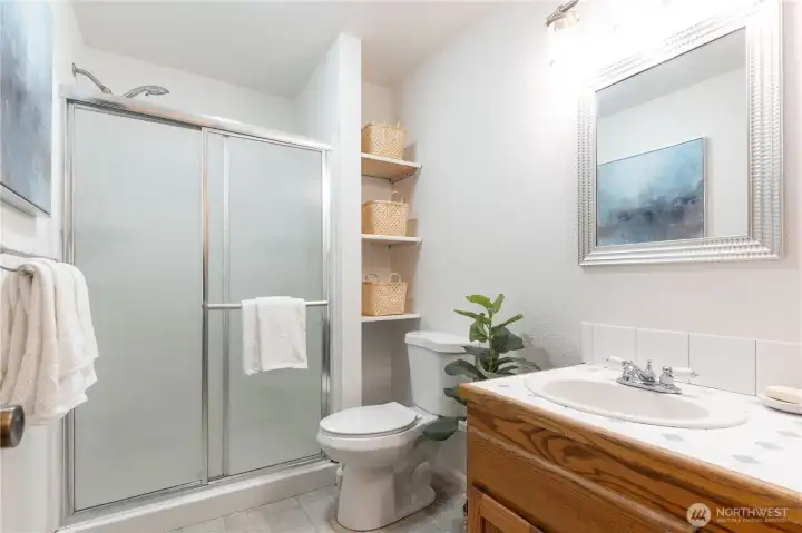Bathroom showing built-in shelving.