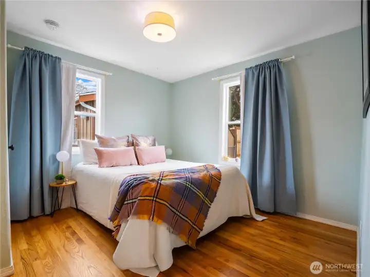 The primary bedroom is located on the main floor and have a view of the backyard.