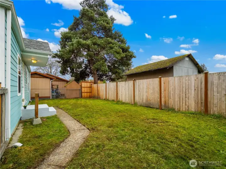 The separately fenced back yard is private.