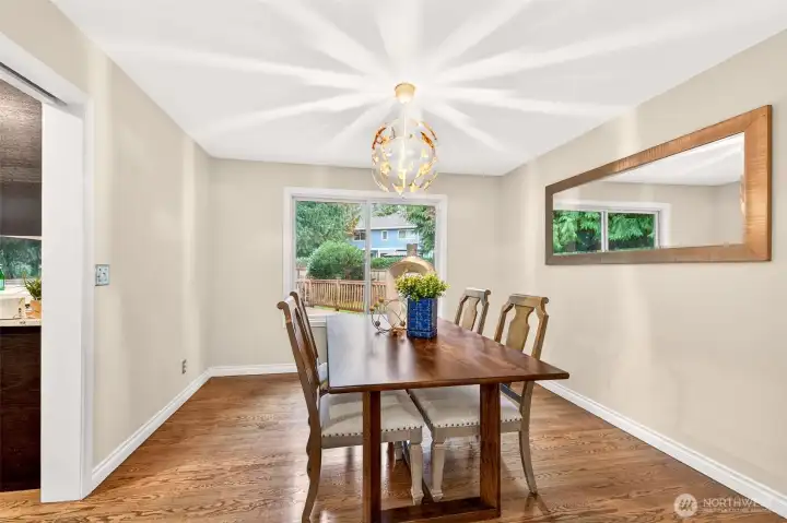 A bay window brings in beautiful daylight and brings nature indoors for peaceful living. This is a flexible space that works beautifully for reading, conversation, or simply enjoying the view outside.