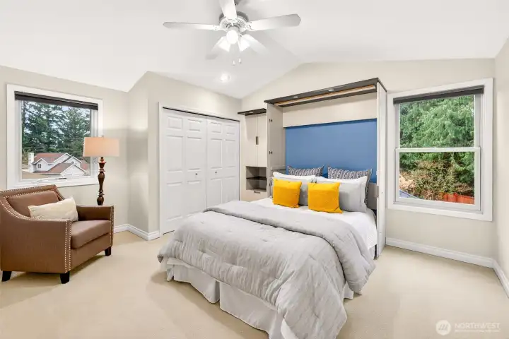 This bedroom stands out with a vaulted ceiling and an included built in Murphy bed system that maximizes flexibility. It works beautifully as a guest room and bonus space, giving you options without sacrificing comfort.