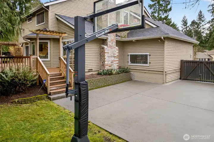 Sport court and deck areas connect for effortless indoor outdoor living, with convenient access back to the deck and main level spaces.