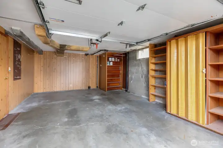 The garage is unusually large for this era home.  The owners drove a Subaru and were able to park it in here and open the doors!  In addition it has plenty of storage + a secret room!